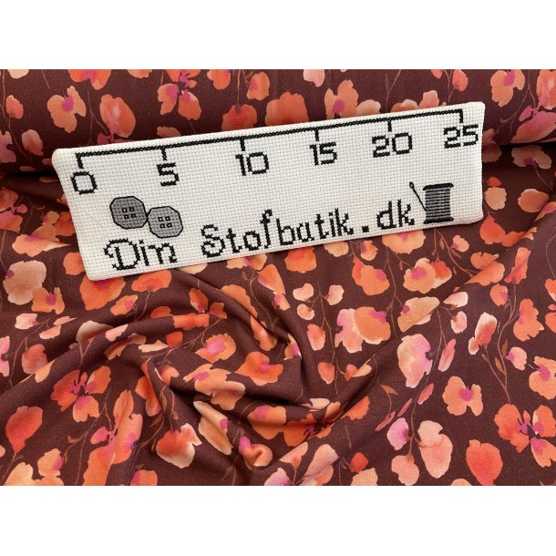 Isoli med bld bagside. 95 % bomuld 5% lycra. KUN 100 kr pr m lvinrd bund med blomster