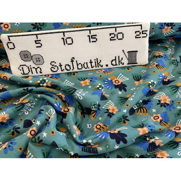 Isoli med bld bagside. 95 % bomuld 5% lycra. KUN 100 kr pr m bl bund med blomster