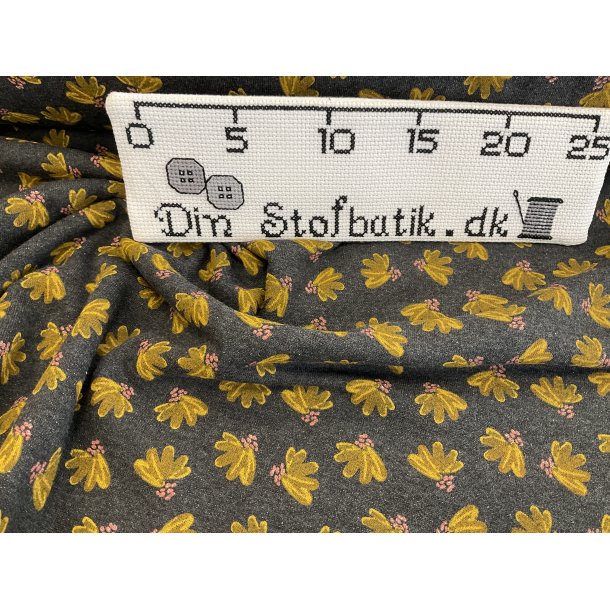 Isoli med bld bagside. 95 % bomuld 5% lycra. KUN 100 kr pr m gr med karry blomst og glimmer