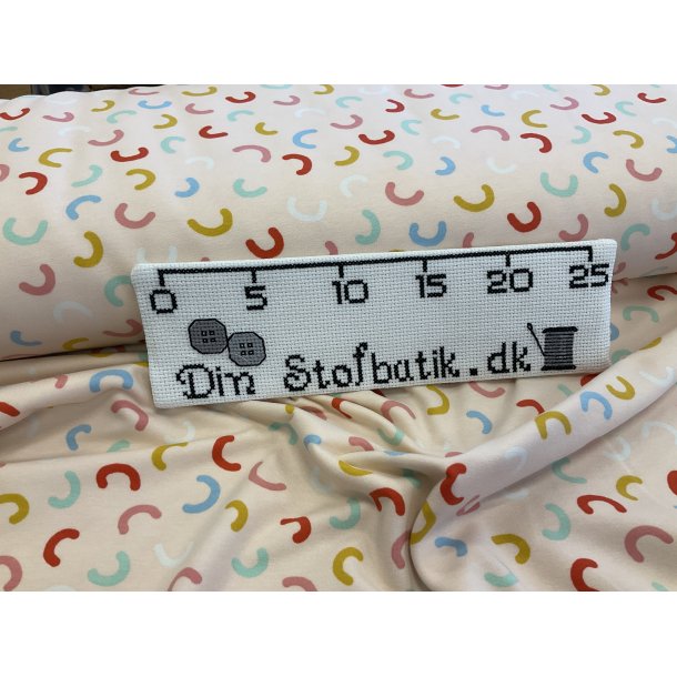 Isoli med bld bagside. 95 % bomuld 5% lycra. 100 kr pr m lyserd bund med regnbuer