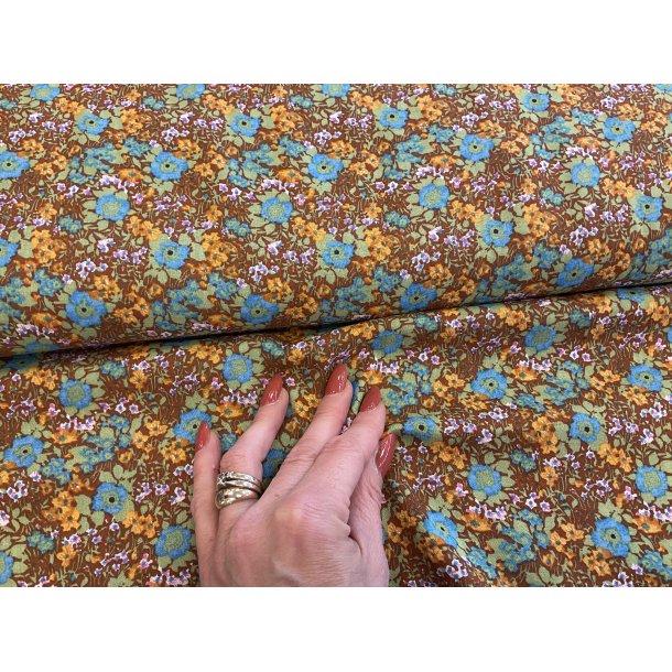 Fast viskose de fineste sm blomster i gyldne varme farver