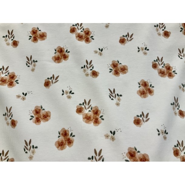 Bomulds jersey hvid bund med fine blomster i rust farve. 145 kr pr m