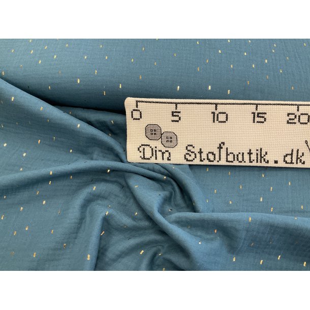 Dobbelt gauze 100 % bomuld, petrol med sm guld nister. 99 kr pr m