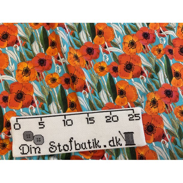 Bomulds jersey klar turkis bund med klar blomster print i orange farver 150 kr pr m