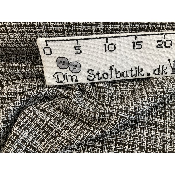 Boucle jakke stof med 30 % uld sort og hvid med lille guld trd.
