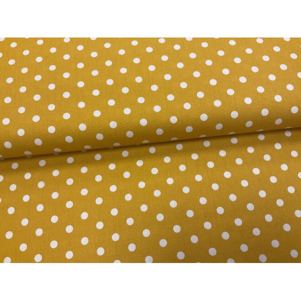 Fast 100 % bomuld poplin ttvvet, varm gul med 1 cm prik. 69 kr pr m.