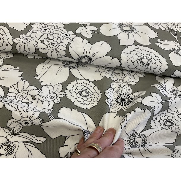 Fast viskose / bomuld med struktur hrfarvet bund og bl blomster. 100 kr pr m