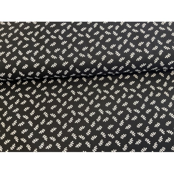 Fast 100 % bomuld poplin ttvvet, sort bund med hvide sm bladmnster. 75 kr pr m