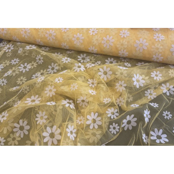 Tyl / mesh med velour blomster i gul. 110 kr pr m