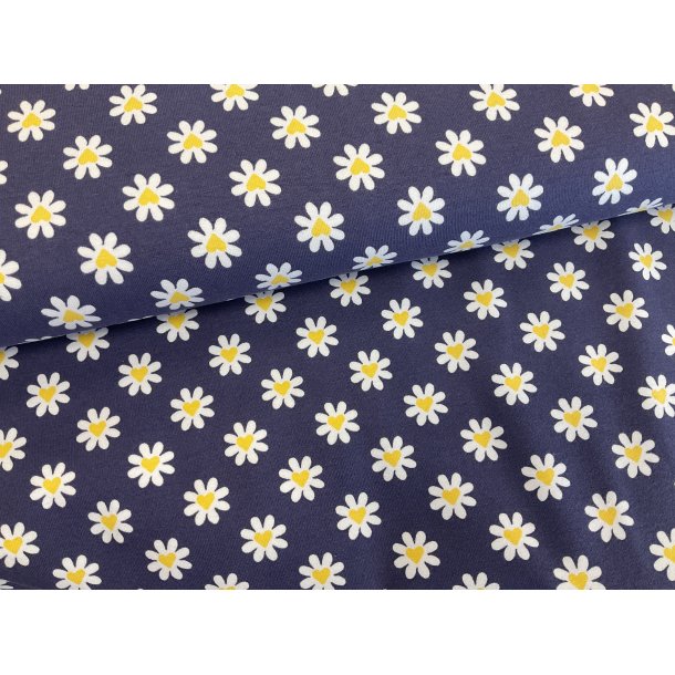 Bomulds jersey marine med med hvide blomster og gul hjerte i midten. 139 kr pr m