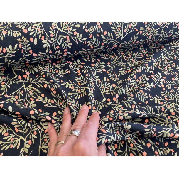 Bomulds jersey marine bund med grene og sm blomster. 129 kr pr m