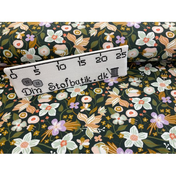 Isoli med bld bagside. 95% bomuld, 5% elastan. Grn bund med blomster. 139 kr pr m