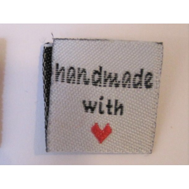 Symrke stof, "handmade with "hjerte"" i hvid m. rdt hjerte