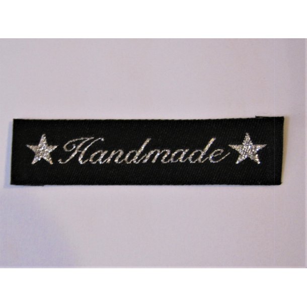 Symrke stof smal. "handmade" skrevet i slv, m. slvstjerner