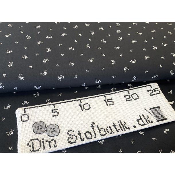 Fast 100 % bomuld poplin ttvvet, sort bund med hvide sm blonster. 75 kr pr m